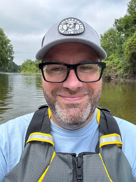 Luke kayaking on the river
